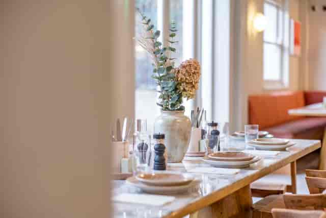 Elegant dining table setup in Jaego's House for corporate events and intimate gatherings.