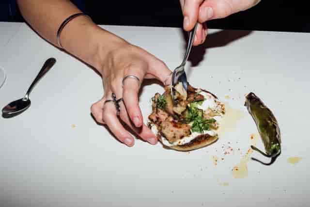 Guest enjoying beautifully plated kebab at Le Bab, enhancing event culinary experience.