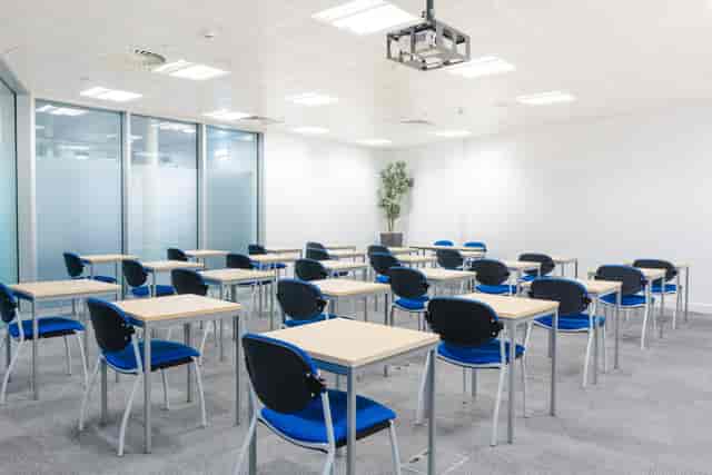 Curzon Rooms at Millennium Point, organized workshop space with projector for training sessions.