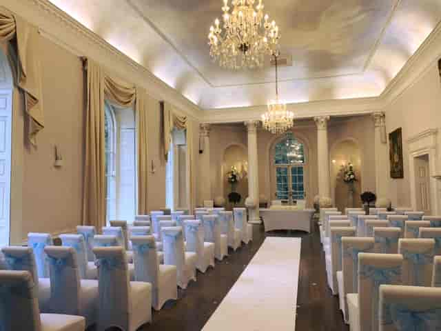 1776 Grand Ballroom at Colwick Hall, elegant wedding venue with soft lighting and blue sashes.