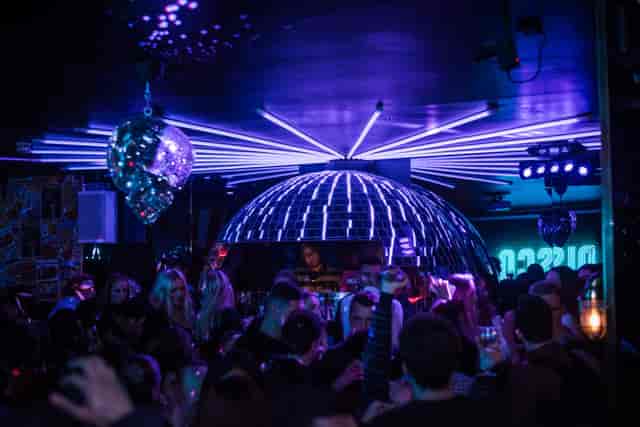 Vibrant nightclub scene with disco ball for energetic events at Simmons Holborn.