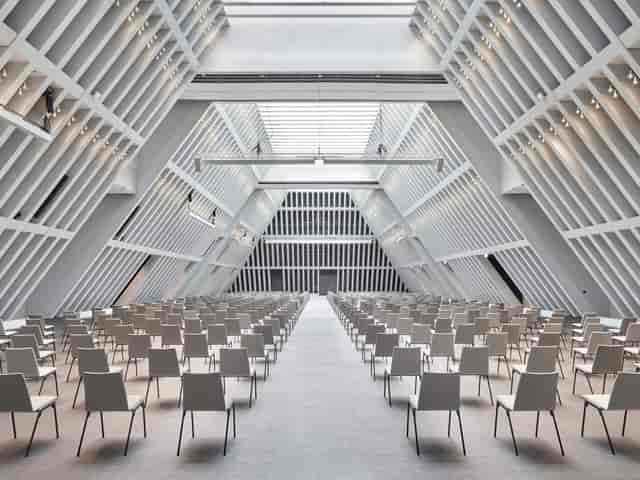 Modern Convention Hall with natural light, ideal for conferences and presentations.