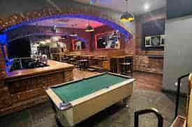 Ski Lodge Manchester event space with pool table, ideal for networking and team-building.
