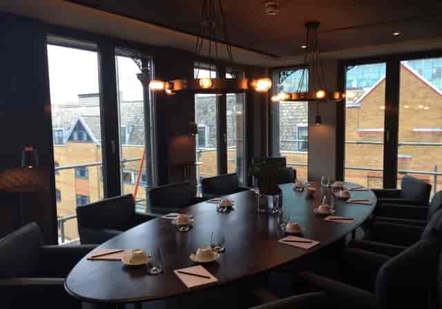 Sophisticated meeting room with round table for executive gatherings at Eight Club.
