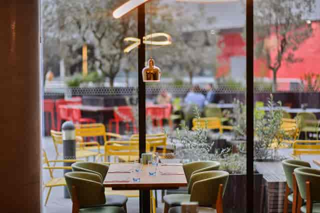 Docksider Restaurant at Aloft London ExCeL, vibrant dining space for casual meetings and events.