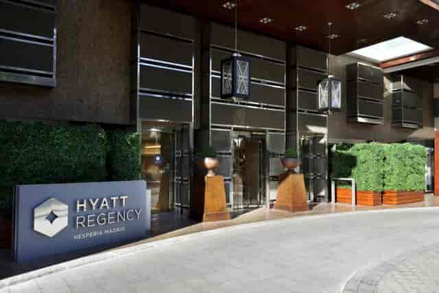 Hyatt Hesperia Madrid entrance, modern facade for corporate meetings and events.
