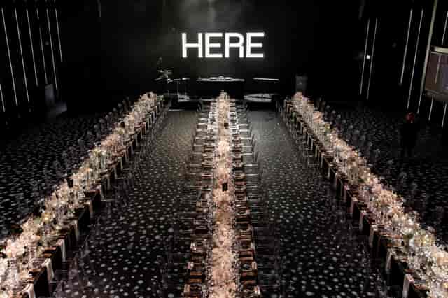 Elegant banquet setup at Outernet, HERE London for corporate events and gala dinners.