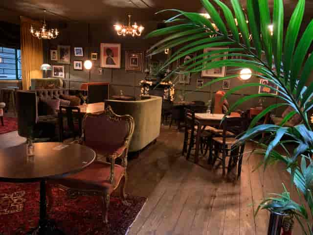 Stylish Roof Garden venue with vintage furniture for intimate networking events.