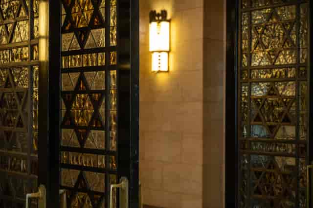 Elegant tower foyer with star motif glass doors, perfect for upscale events and receptions.