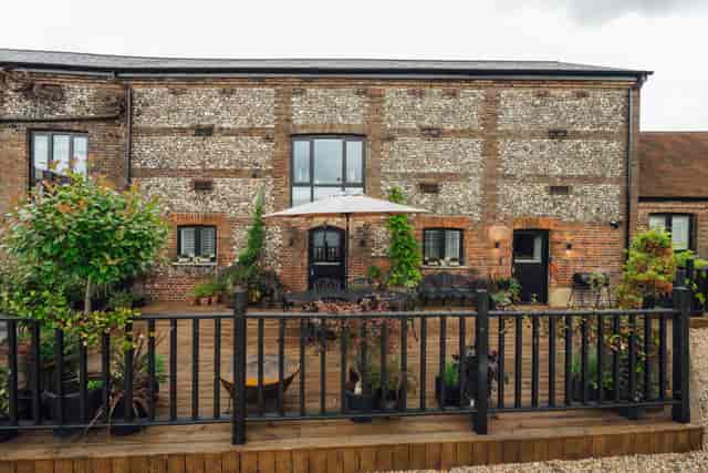 Luxury Bunkers Barn venue with rustic exterior, ideal for outdoor events and gatherings.