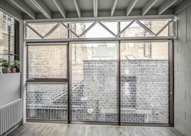 Modern Green Room at Holborn House, ideal for meetings and workshops with natural light.