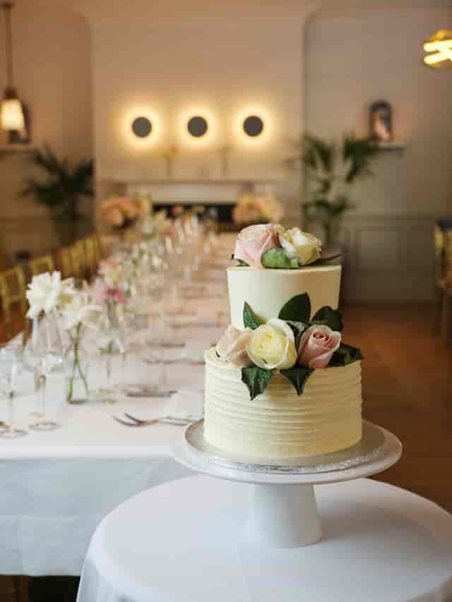 Elegant dining table with decorated cake at Cento, 100 Queen's Gate Hotel, London.
