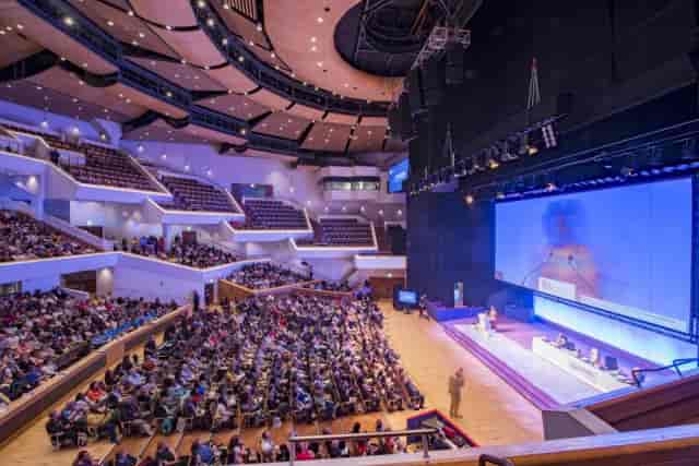 Main Auditorium in ICC Belfast with tiered seating for impactful conferences and events.