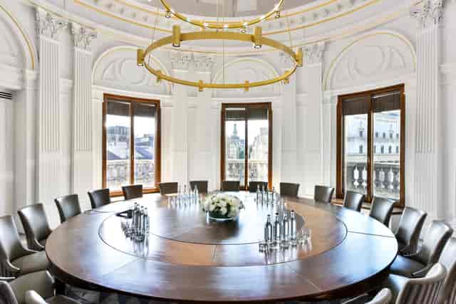 Rooftop bar meeting room with circular table and elegant decor for professional events