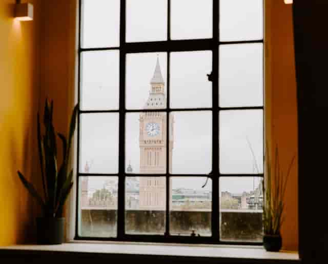 Big Ben view through industrial window, perfect for corporate events and gatherings.