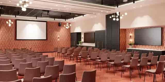Modern event space at The Theatre in Malmaison York with dual screens for presentations.