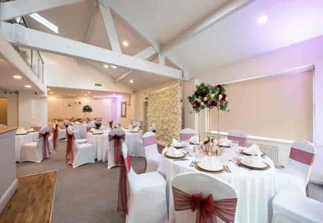 Elegant Bluebell Suite event space with round tables, ideal for weddings and gatherings.