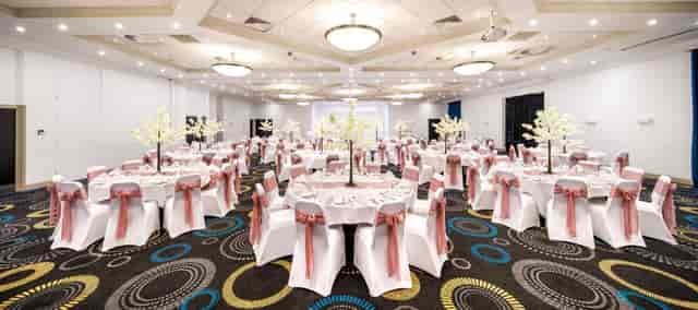 Telford Suite at Mercure Hotel, elegant wedding venue with floral centerpieces.