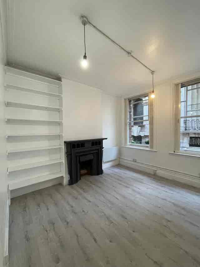 Minimalist meeting space with fireplace for intimate events at Saras Venue.