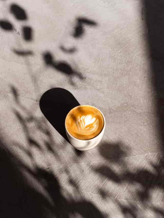 Latte art in a cozy setting, ideal for networking and casual meetings.