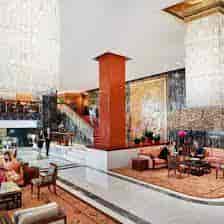 Elegant Mandarin Oriental Hotel lobby with grand staircase, perfect for events and meetings.