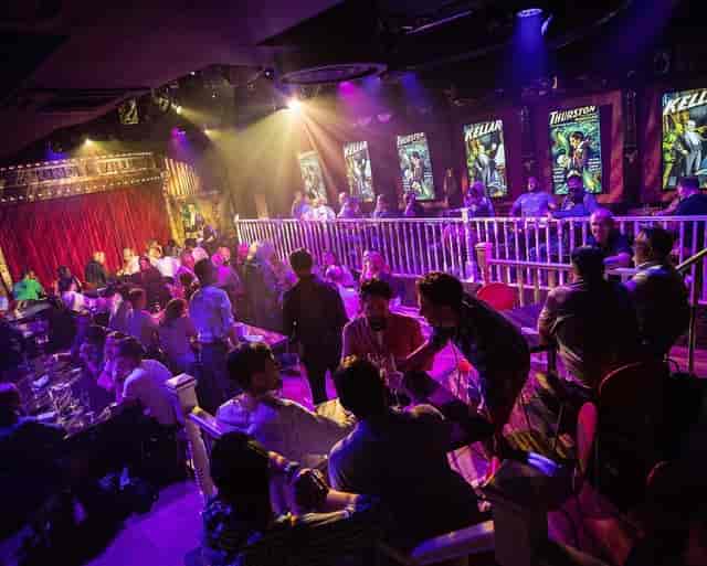 Wonderville venue with tiered seating and theatrical lighting for corporate mixers or galas.