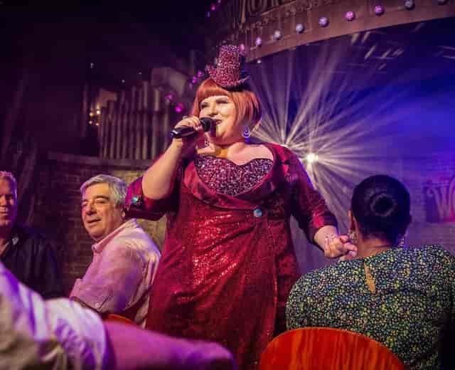 High-energy cabaret venue with stage lighting for corporate events and interactive activations.