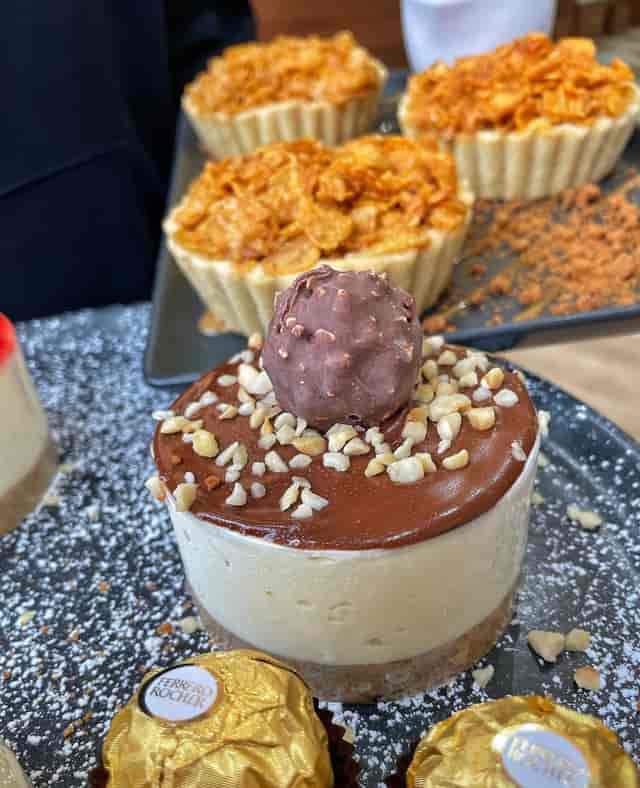 Rich chocolate mousse dessert with nuts for event catering and meetings.