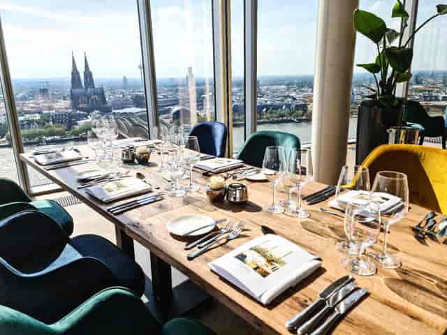 Elegant dining table in modern venue, perfect for upscale events in Koelnsky.