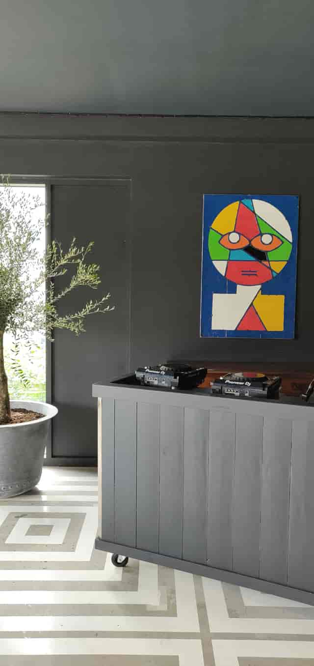 Nico's Bar in Hackney Bridge: modern event space with DJ setup and vibrant artwork.