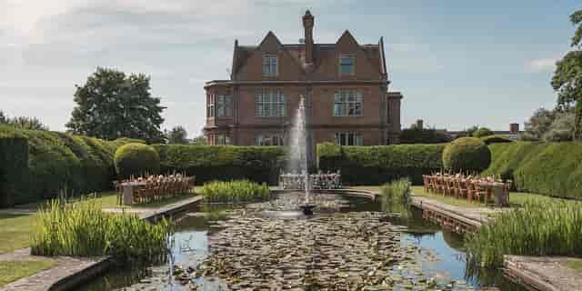 The Cook Suite at Horwood House: elegant outdoor venue with manicured garden for weddings.