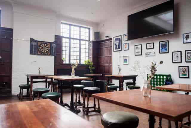 Games Room in Beehive with wooden seating, ideal for networking and team-building events.