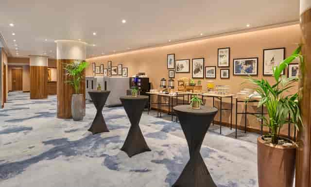 The Bridewell Suite at Hyatt Regency London, modern event space with high-top tables.