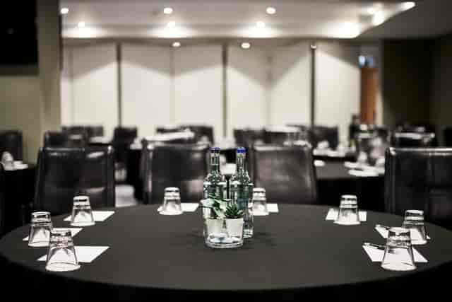 Meeting room at The Cumberland Hotel with round tables, ideal for professional gatherings.