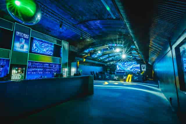 Fire Mirror Arch event space with dynamic lighting for corporate events and private parties.