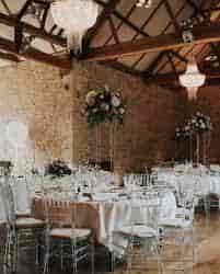 Elegant barn wedding setup with floral centerpieces at Botley Hill Barn.