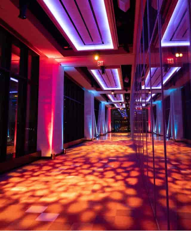 Modern event space with vibrant lighting for networking events at The Glasshouses.