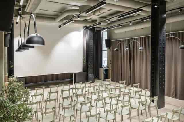 Versatile event space in Chambre Champagne Stockholm with modern lighting for corporate meetings.
