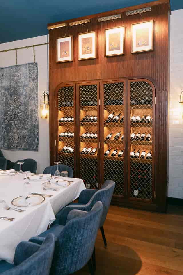 Elegant wine cabinet in The State Room, Yaatra Restaurant for upscale events and dinners.