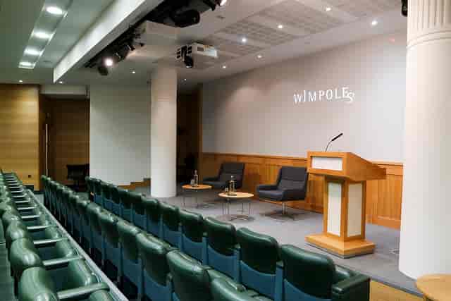 Max Rayne Auditorium event space with podium, ideal for presentations and panel discussions.