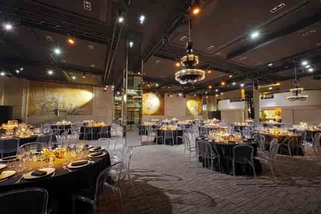 Elegant Vendome event space with black linens, ideal for corporate dinners and upscale celebrations.