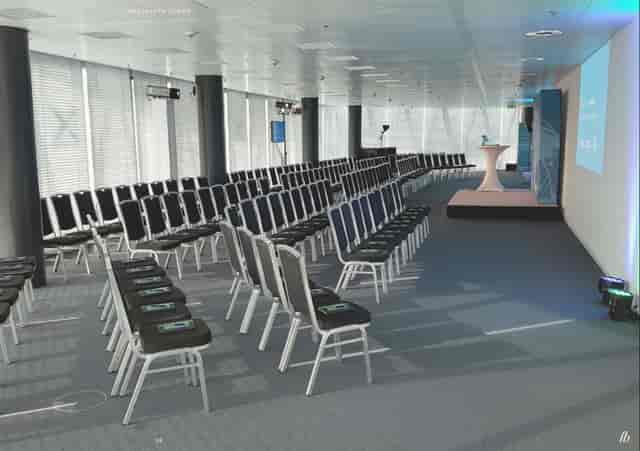 Westhafen Tower meeting space with podium, ideal for presentations and events.