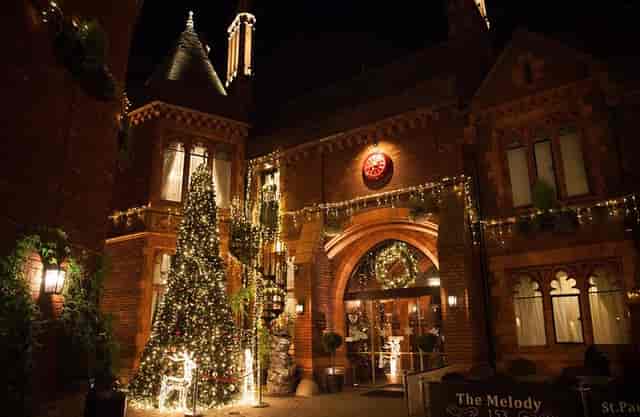Illuminated Melody Restaurant with Christmas tree, ideal for festive events and gatherings.