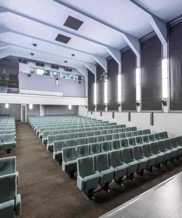 Ciné Lumière auditorium with tiered seating for conferences and presentations.