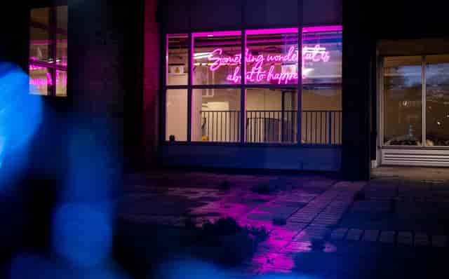 Vibrant FUSEBOX venue with neon sign, perfect for creative events and parties.