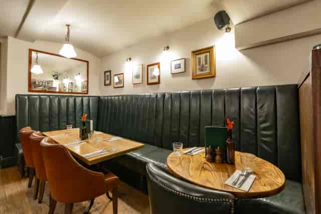 Cozy dining room with plush seating for intimate meetings and small events.