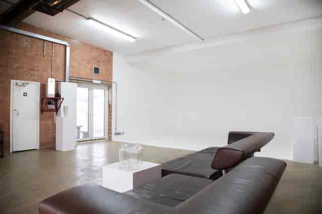 Versatile event space in Bow Bunker, East London with exposed brick walls and natural light.