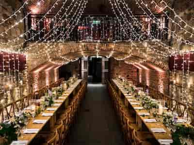 Elegant banquet table in Vaulted Cellars, perfect for weddings and upscale events.
