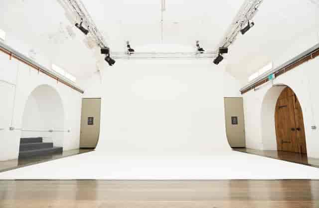 White Rabbit Cafe event space with bright white backdrop, ideal for workshops and photo shoots.