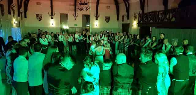 Lively dance event in Argyllshire Gathering's spacious Drawing Room, vibrant atmosphere.